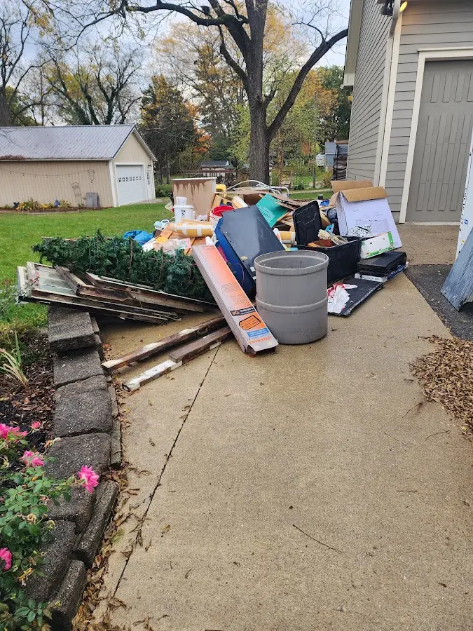 Dumpster being loaded with debris for 30 Yard Dumpster Rental in Newcomerstown